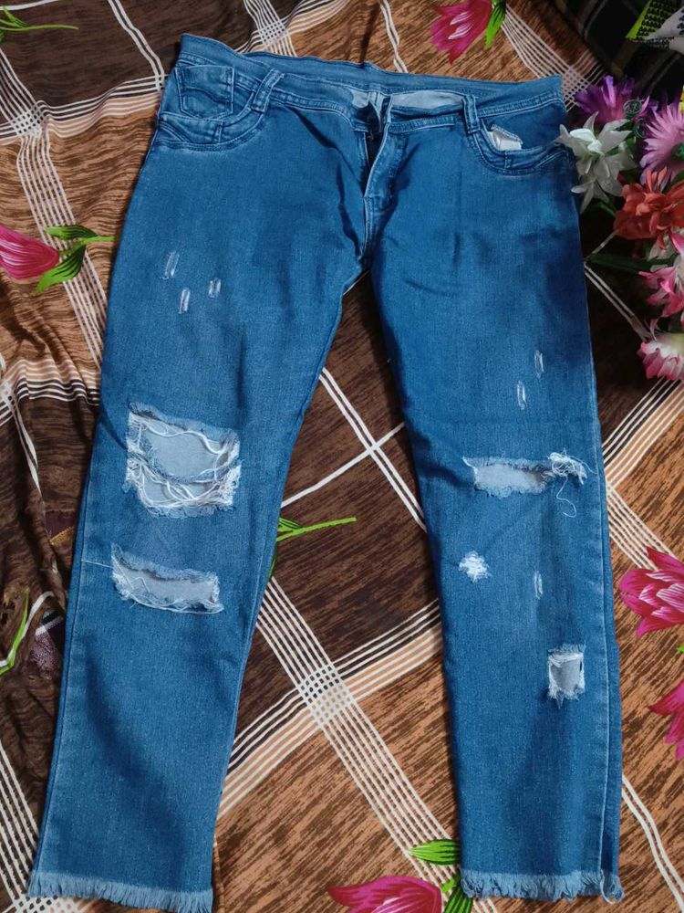 Ripped Blue Denim Jeans