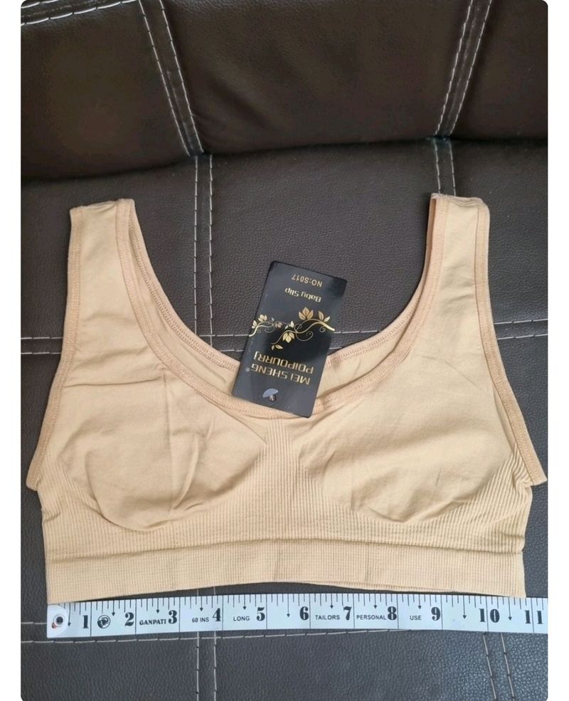 Black Woolen Cap, Skin Sports Bra, Pink Headband