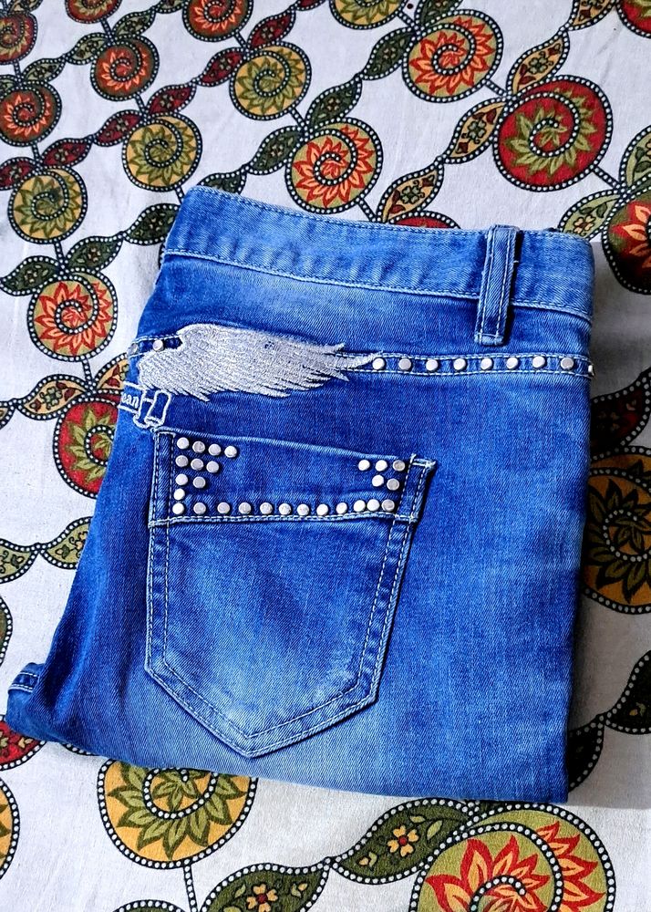 Girls ripped embroided jeans like new.