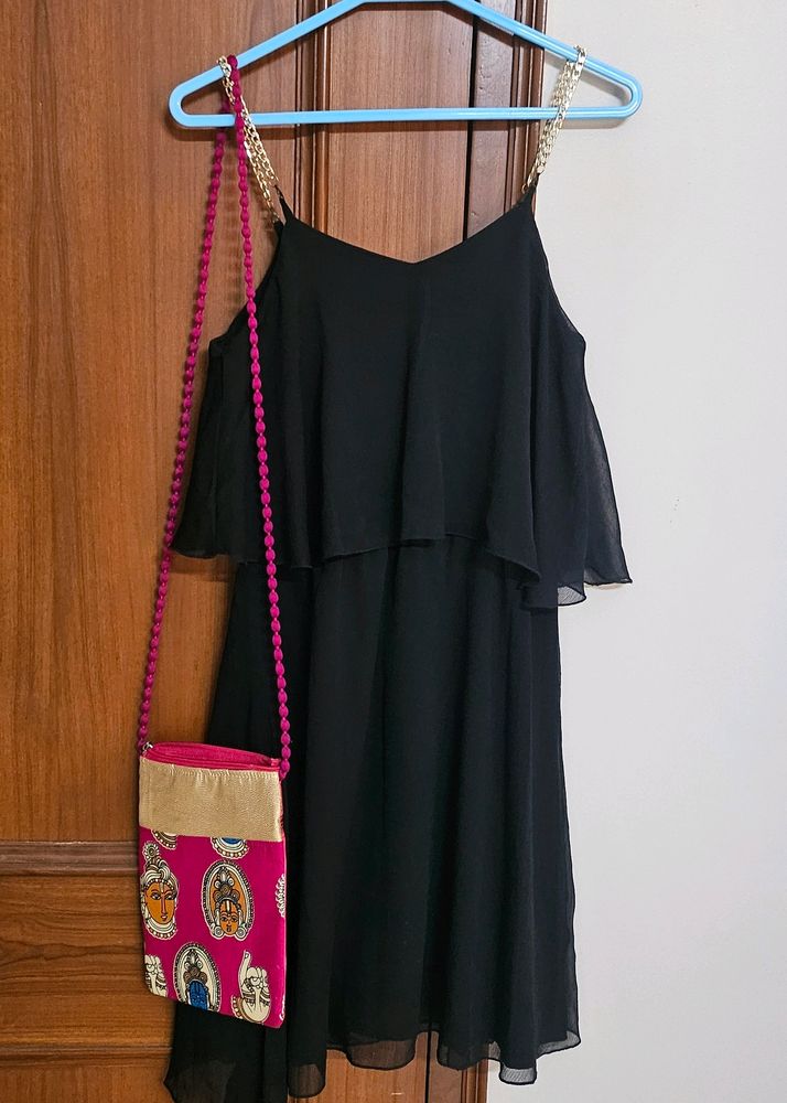 Black dress with sling bag