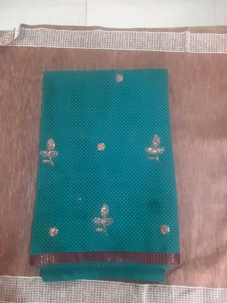 Ambroider saree without blouse.