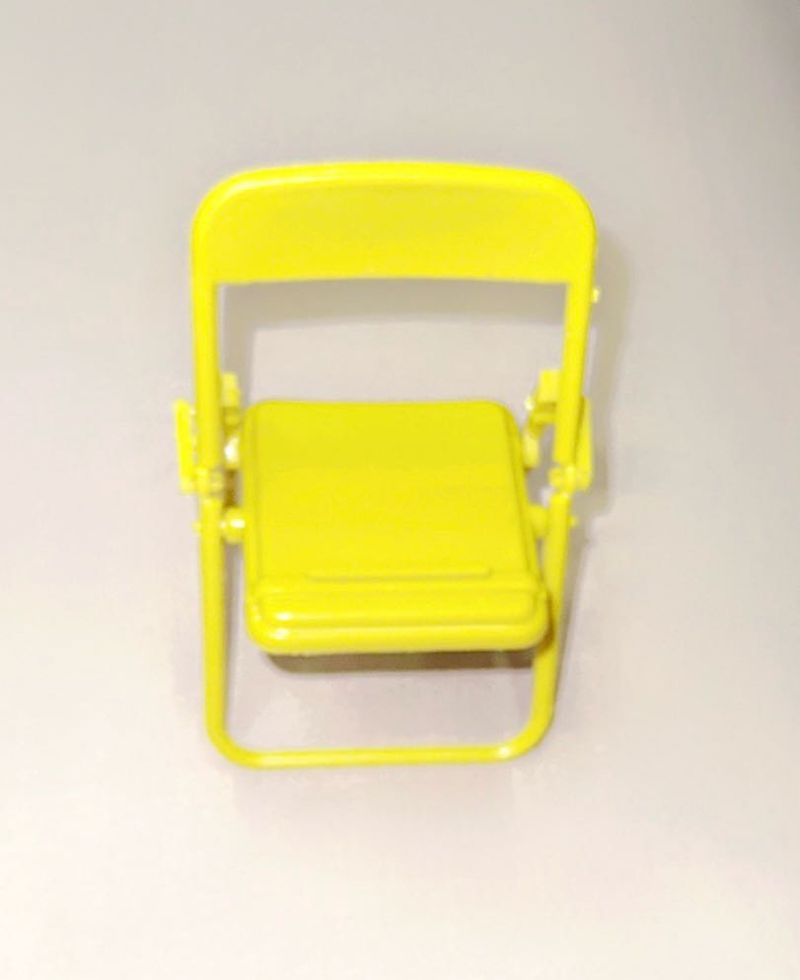 A miniature yellow folding chair Stand