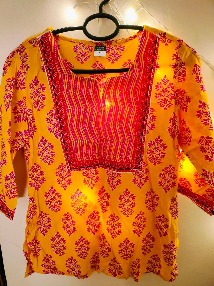 A Yellow Floral Print Tunic For Women