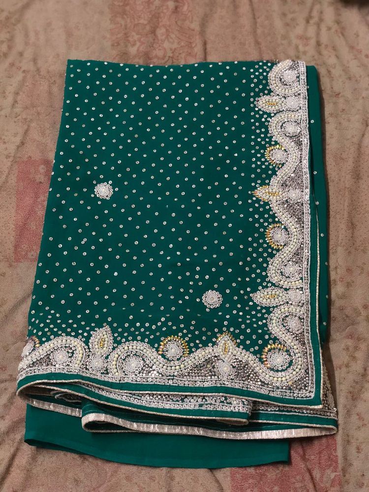 Green saree with beaded border