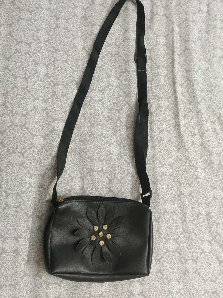 Stylish Black Sling Bag with Floral Cut Design