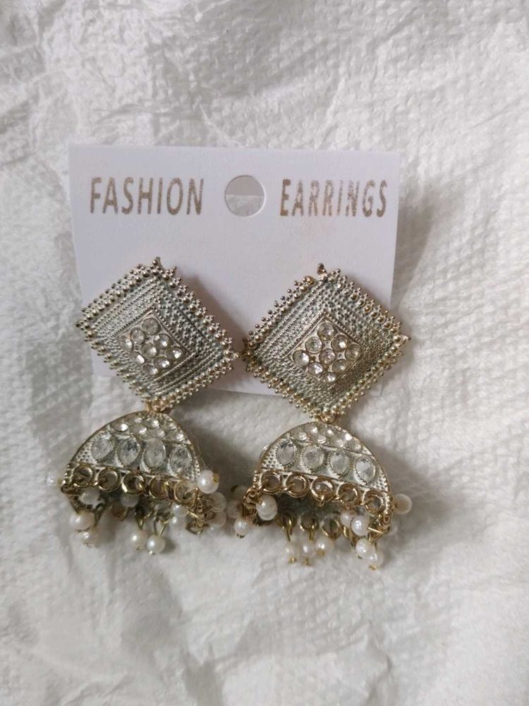 Off White Diamond Jhumkass With Malaa