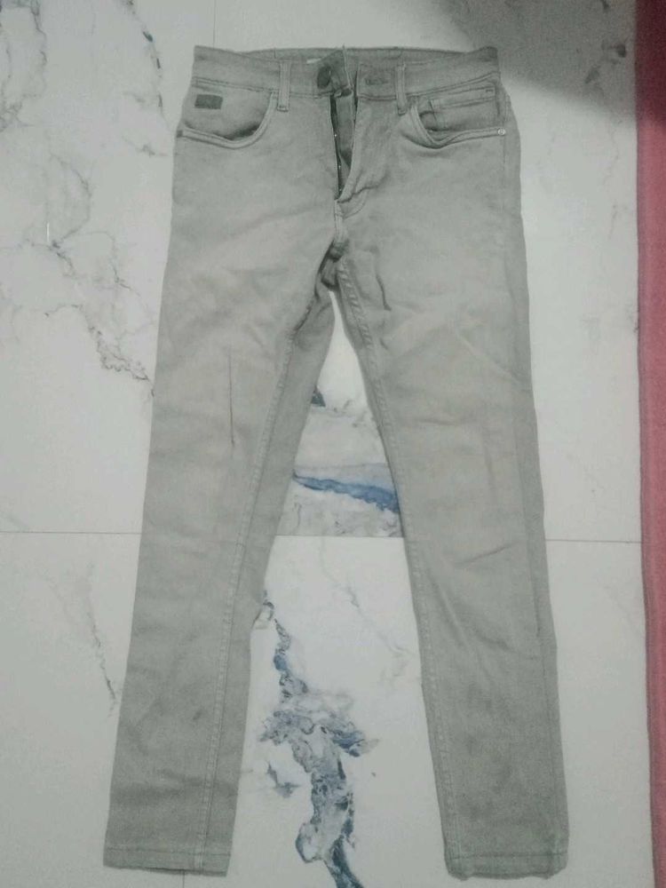 Gray Denim Jeans and a half shoulder shirt.