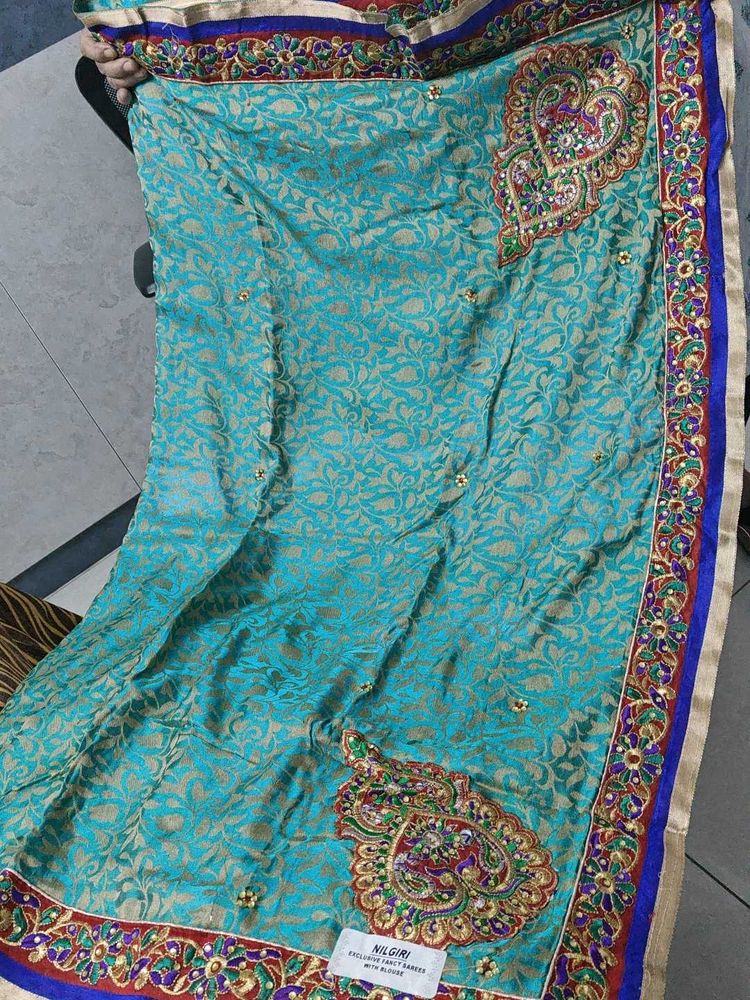 Teal And Red Embellished Saree