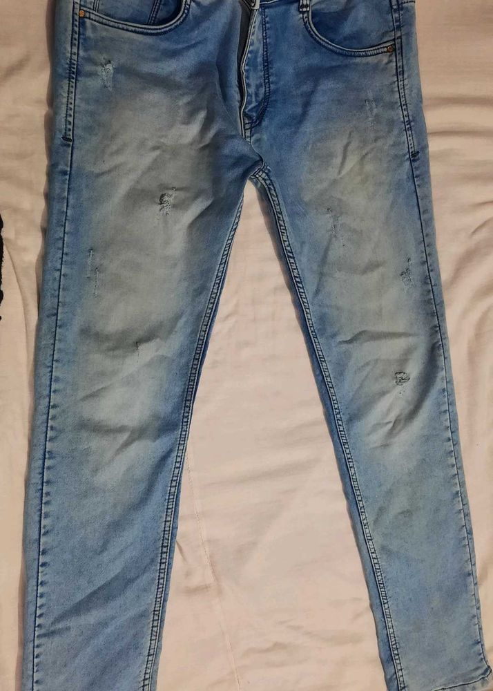 Light Wash Distressed Denim Jeans