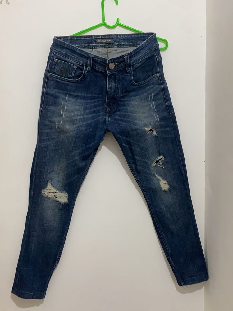 Ripped Blue Denim Jeans