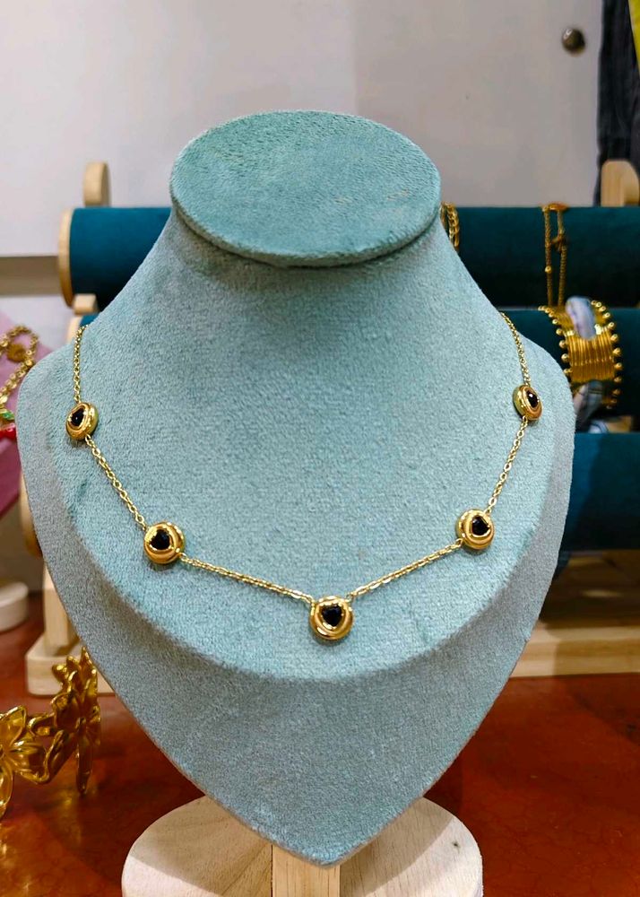 Gold Chain Necklace Featuring black bead or onyx