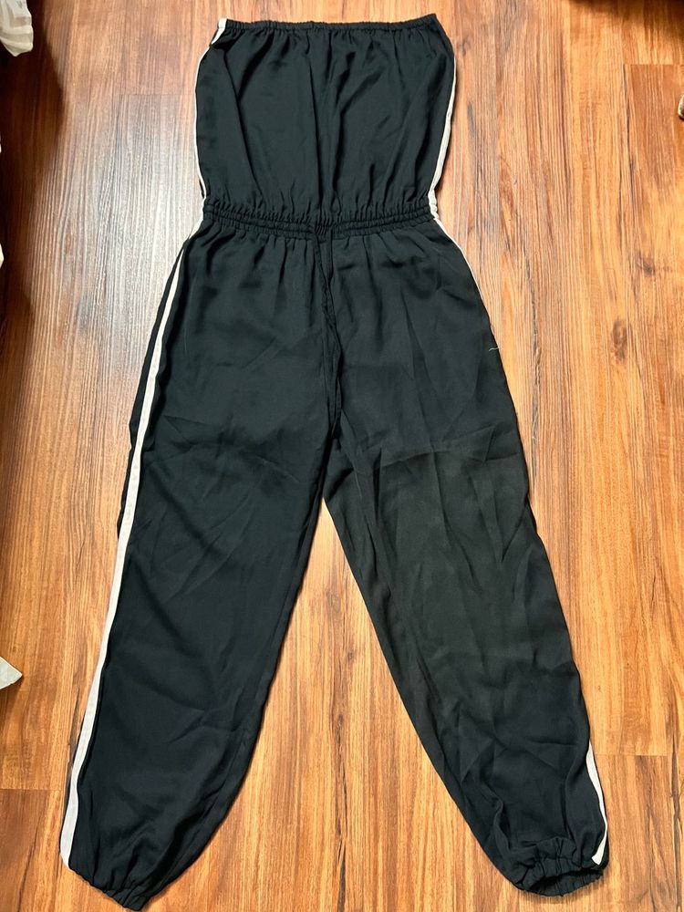 This sleek and stylish off-shoulder tube jumpsuit