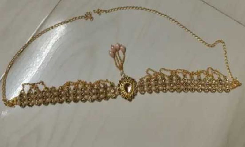 Gold tone headpiece