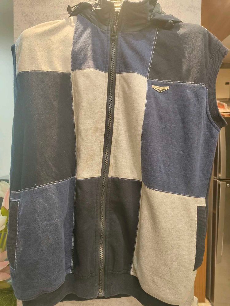 Woolen Sleevless Jacket With Attached Cap