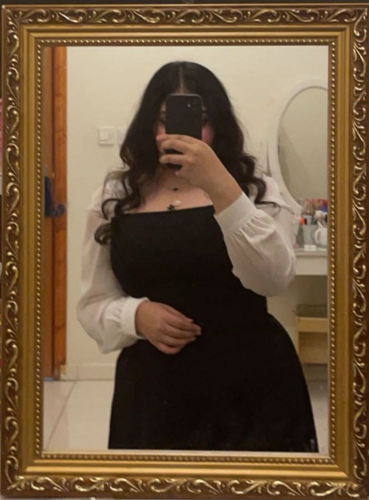 Chic black dress with white sleeves