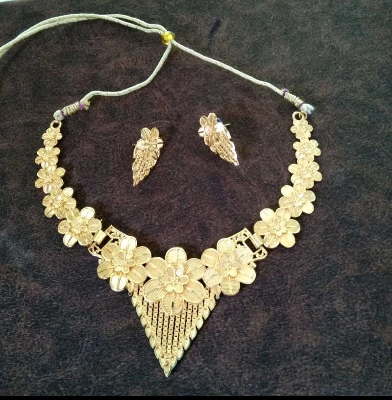 Golden necklace set.