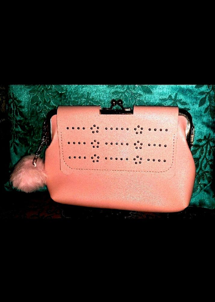 Pink kiss-lock coin purse