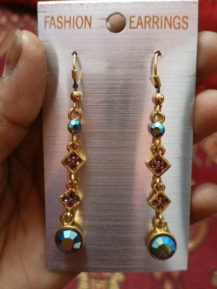 brand new ..beautiful holographic stone long earing..can go with ethnic and western both outfits..