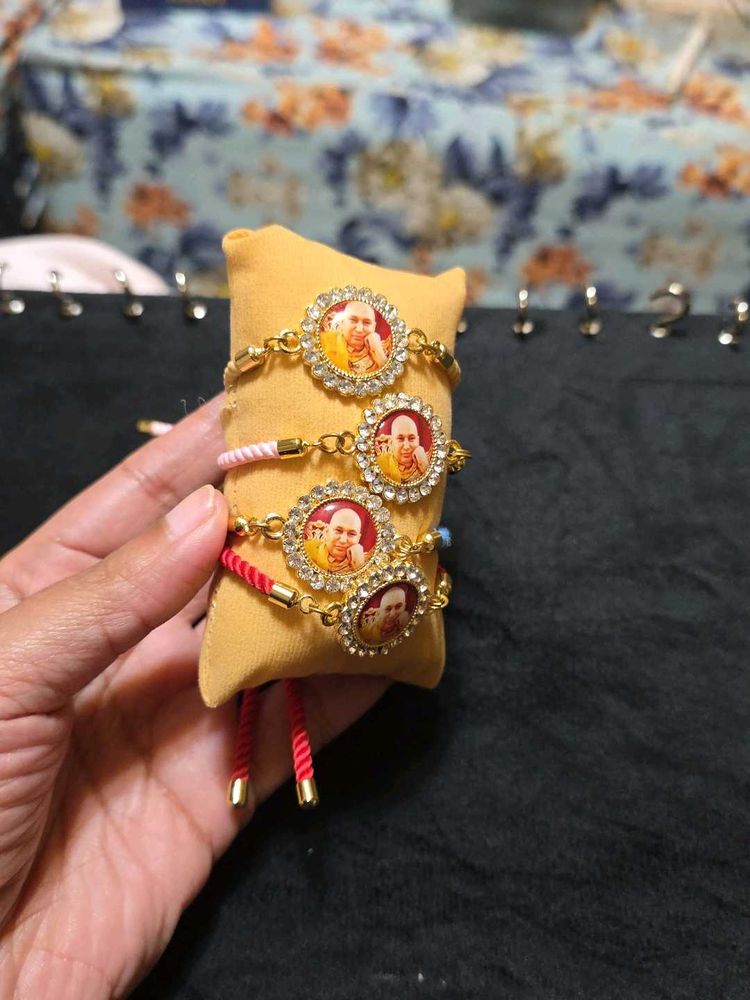 Set Of Four Guruji Thread Bracelets With Cushion