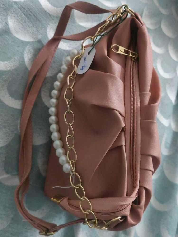 Stylish Pink Handbag with Chain Detail