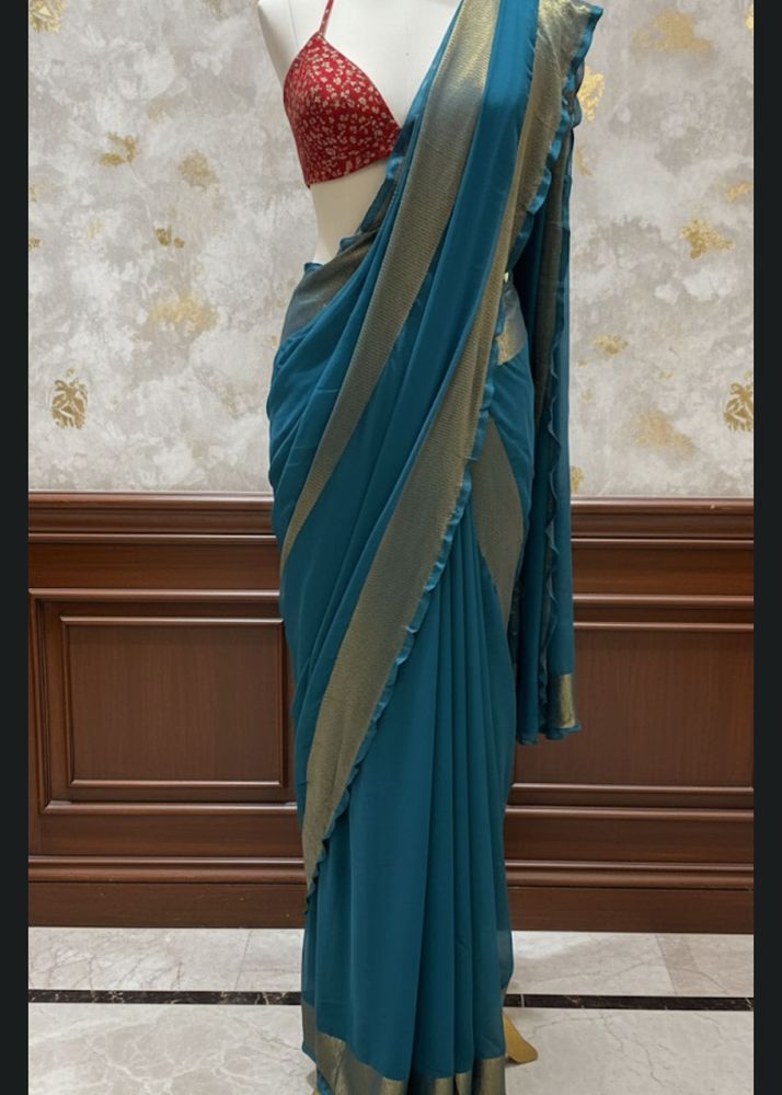 Teal Saree with Golden Border