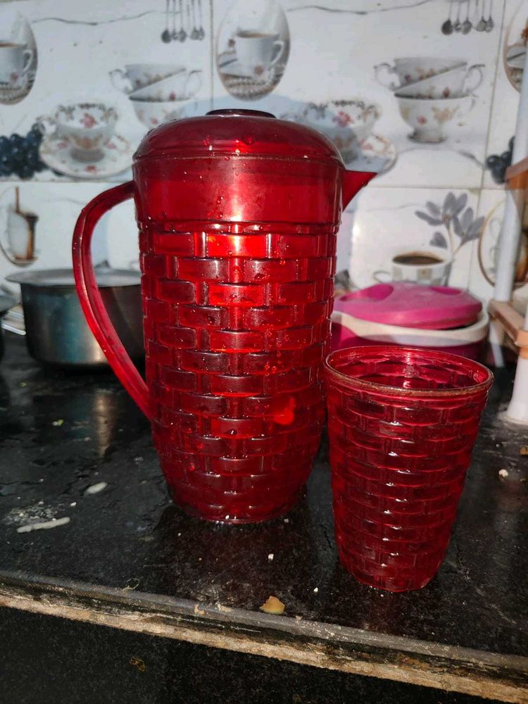 Red Plastic Pitcher with Glass