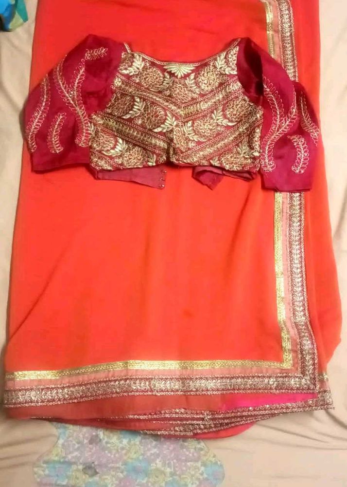 Orange Saree with Embroidered Blouse