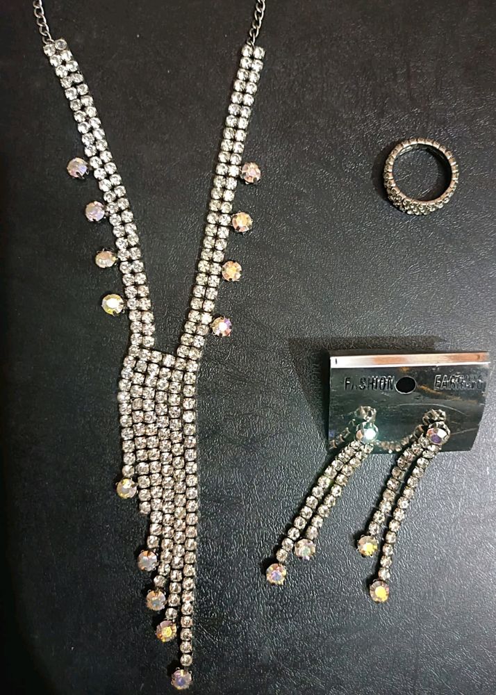 silver nacklace with ear ring and ring only one time Used