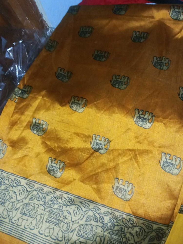 Ethnic Elephant pring yelloish orange saree...