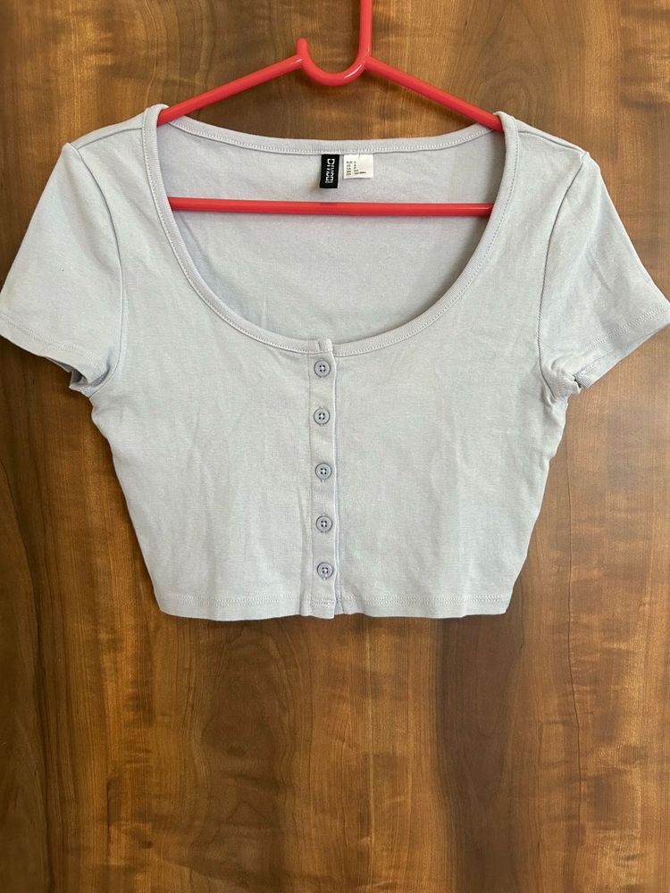 Fitted crop top with button front and scoop neck