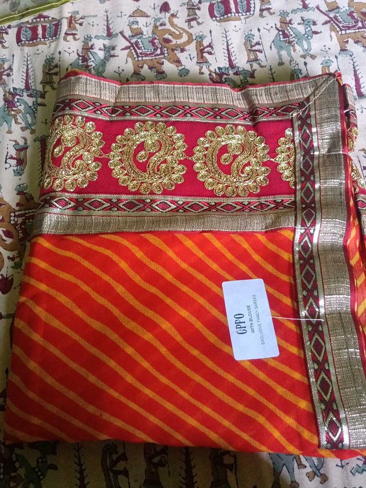 Orange Leheriya Saree with Embellished Border
