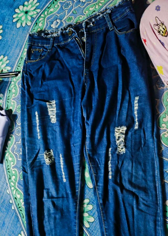 Ripped Blue Denim Jeans