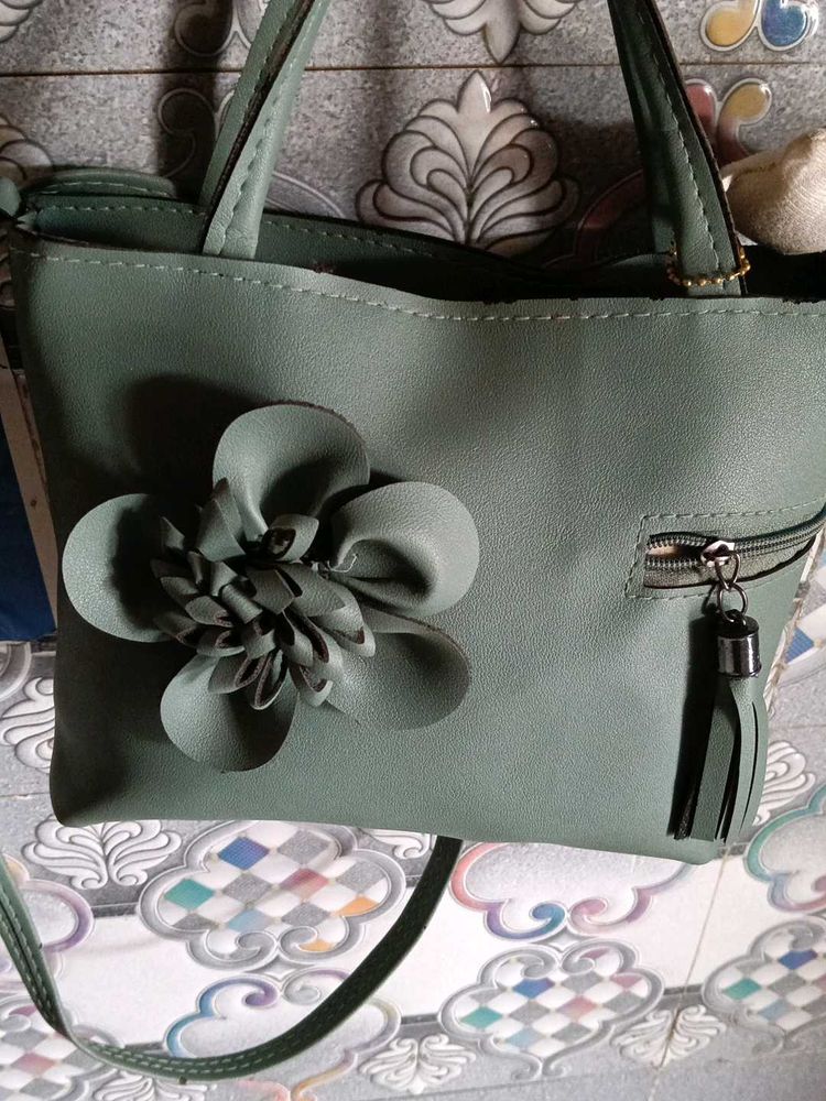Elegant Green Handbag with Floral Detail