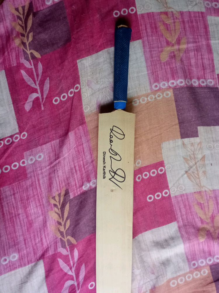 Cricket Bat With A Signature Of Dinesh Karthik