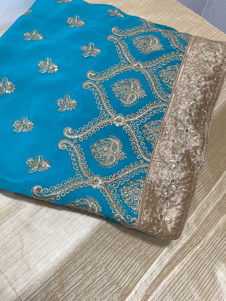 Heavy embroidery sea green saree