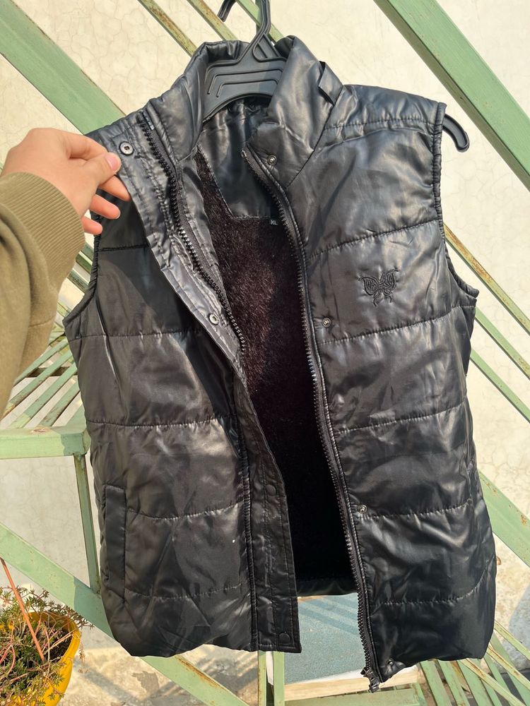 Almost brand new sleeveless black jacket