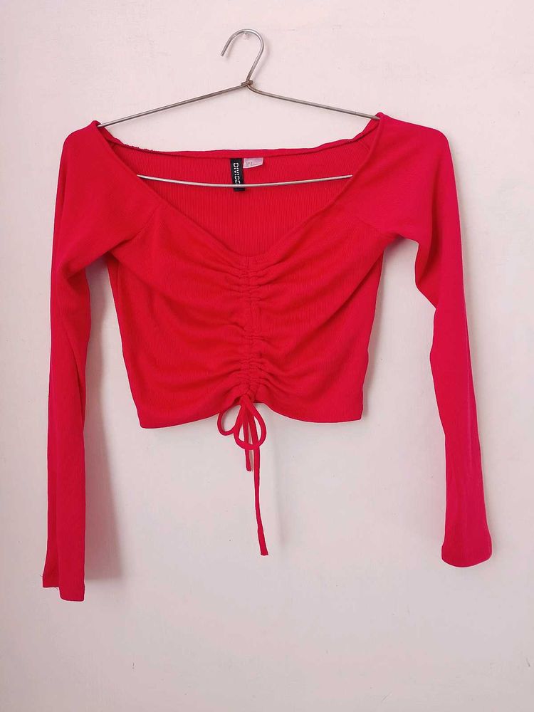 branded red long sleeves crop top.