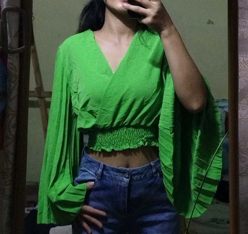 Bright green crop top.