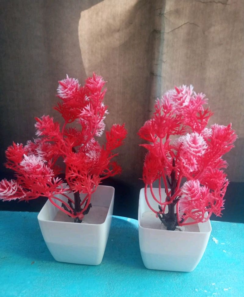 brand new flower pots , beautiful red coloured artificial flowers