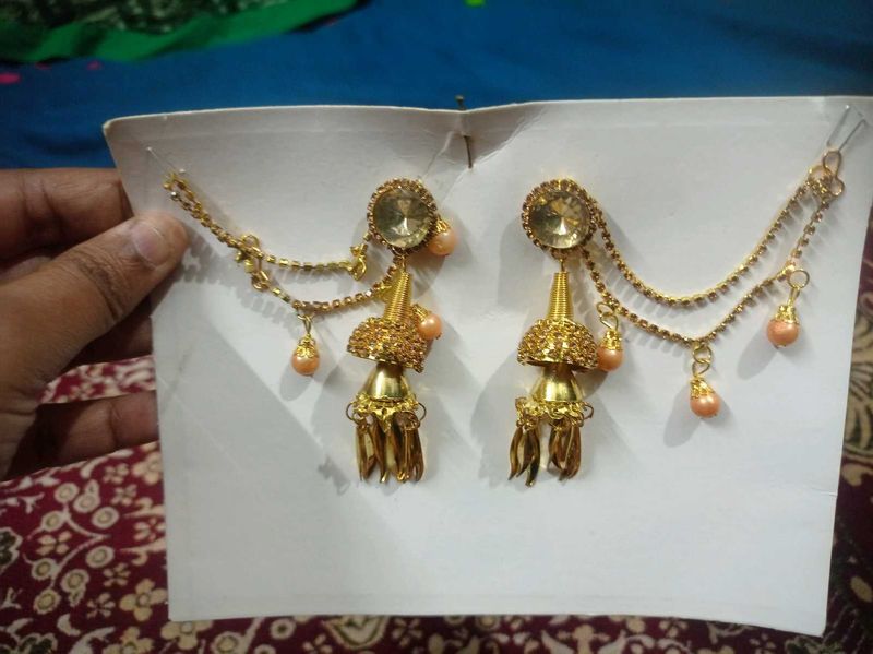 Gold toned Jhumka Earrings with Hair Chain