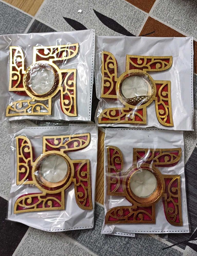 set of four diyas with swastik