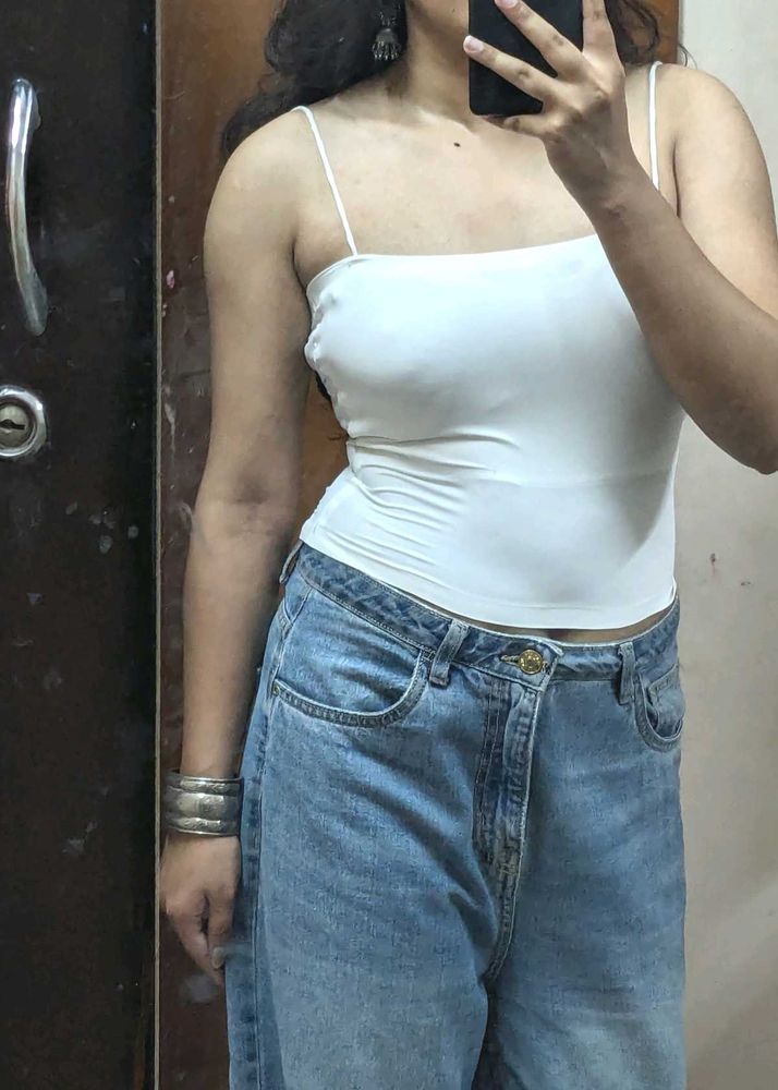 Pair Of White Sleeveless Tops