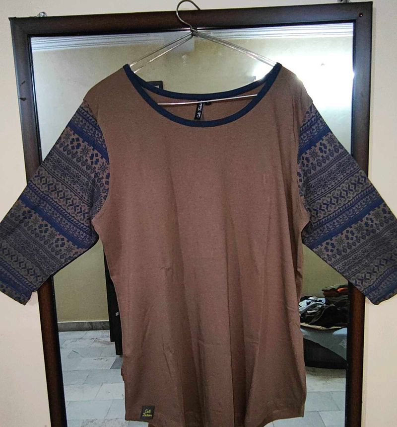Brown T-shirt with Patterned Blue SleevesCita