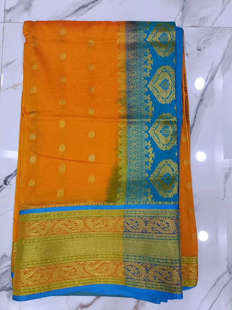 Orange and sky blue combination saree