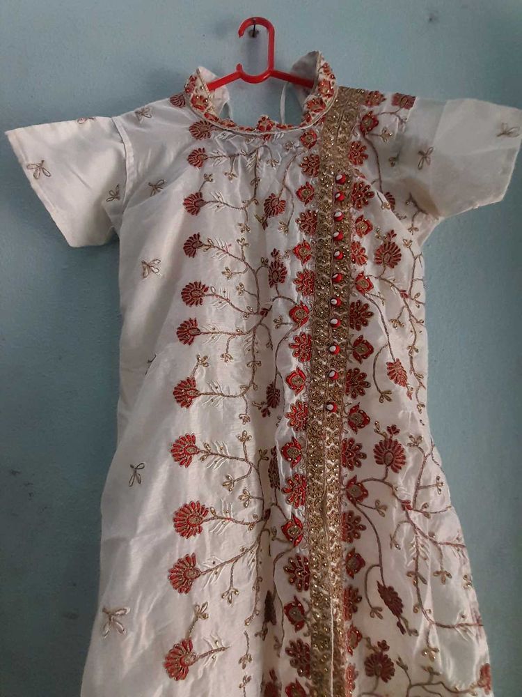 Beautiful White Coloured Gown. Festive Type.