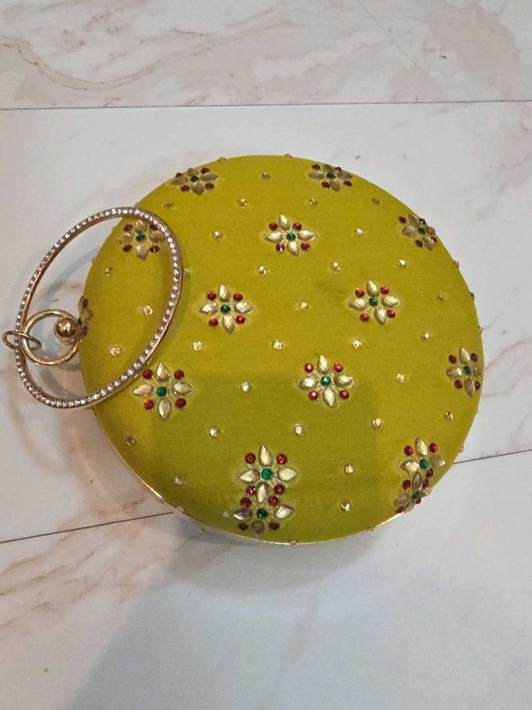 Mustard round Embroidered Clutch