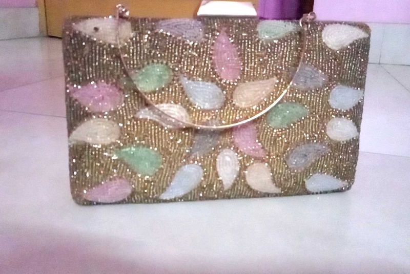 get this  embroidered branded cluch @499