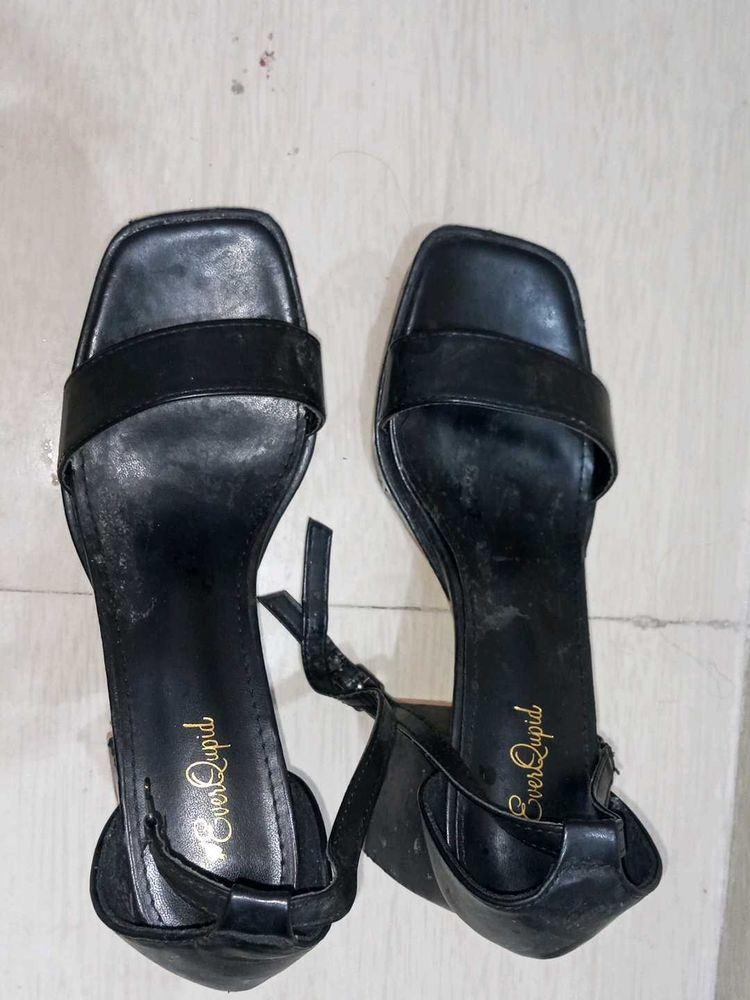 Strappy front open 3 inch black heels.