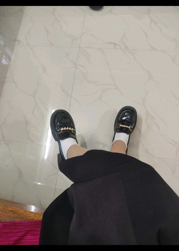 Elegant Black Glossy Loafers with Gold Chain.