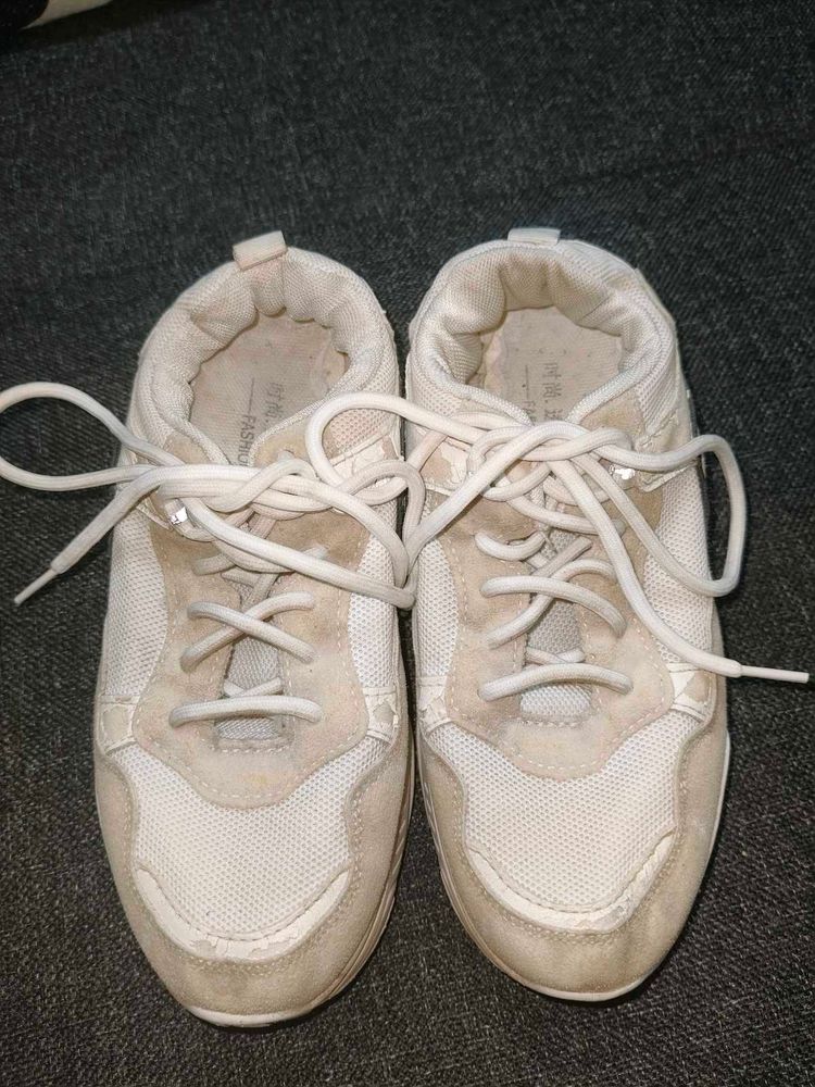 Vintage-Style Off-White Sneakers